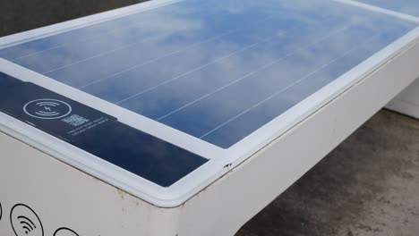 Alternative-renewable-energy-modern-smart-solar-bench-USB-wifi-charging-station-dolly-left