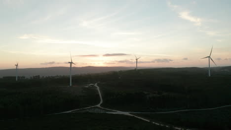 Fly-Towards-Scenic-View-With-Wind-Turbines-Against-Bright-Sky-During-Sunset-In-Serra-de-Aire-e-Candeeiros,-Leiria-Portugal