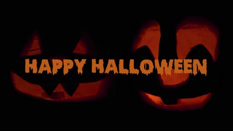 Feliz-Halloween-2-Jack-O&#39;-Lanterns-Que-Brillan-En-La-Oscuridad-Con-Animación-De-Texto-Deseando-Feliz-Halloween:-Adornos-De-Calabaza-Tallada-Con-Velas-Encendidas-En-El-Interior