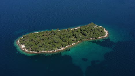 Beautiful-Island-Rutnjak-in-Adriatic-Sea-surrounded-witw-Blue-and-Tirkiz-Sea---Aerial-Drone-View