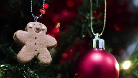 Ginger-bread-man-decoration-on-a-green-artificial-Christmas-Tree