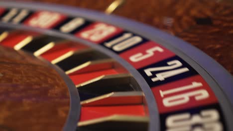 Roulette-in-casino-spinning,-extreme-closeup-view-of-numbers-with-no-ball