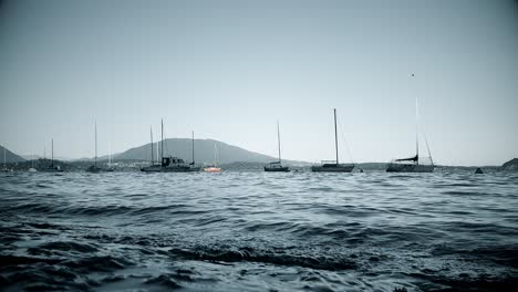 Low-angle-view-of-Lake-Maggiore-with-small-anchored-boats