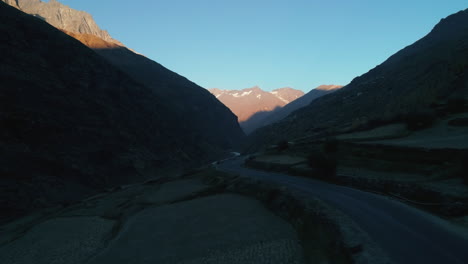 Aerial-shot-of-a-deserted,-curvy-high-mountain-highway-road