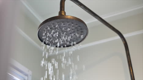 Close-up-of-water-running-from-a-shower-head