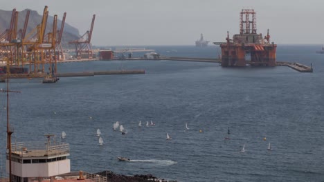 Sailboat-Regatta-Next-To-A-Busy-Shipyard-Time-lapse