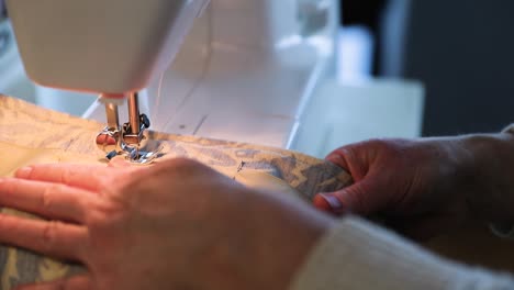 Close-Up-Of-Woman-Using-Sewing-Machine-In-Slow-Motion