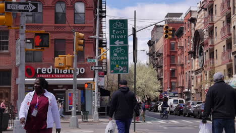 Street-Traffic,-Pedestrians-Walking-Through-Lower-East-Side-Crosswalk-in-Manhattan-New-York-City