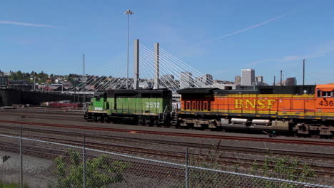 Wide-shot-of-old-BNSF-Train-passing-train-station-of-Fort-Worth-during-blue-sky-and-sunny-day