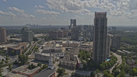 Atlanta-Georgia-Aerial-v684-dolly-out-shot-of-skyscraper,-church-and-office-buildings-in-Buckhead---DJI-Inspire-2,-X7,-6k---August-2020
