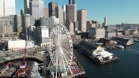 Rotating-aerial-of-Seattle-harbor-Ferris-Wheel-on-bright-sunny-day