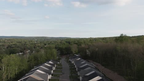 Great-areial-drone-footage-from-Founders-Ridge,-drone-flying-straight-up-from-suburban-street-to-reveal-amazing-view-of-surrounding-forest