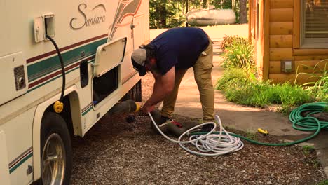 A-coachmen's-waste-hoses-being-setup-on-a-Summer-day-in-2020