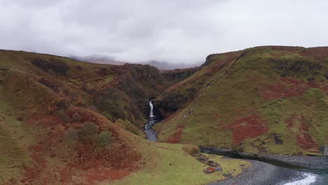 Aerial-Drone-flyover-of-Lealt-Fall-waterfall-in-Skye-Scotland-Autumn
