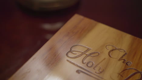 Close-up-of-wooden-book-box-labeled-The-Holy-Bible