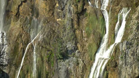 View-of-the-tall,-thin-waterfalls-of-Veliki-Slap-in-Plitvice-Lakes-National-park-in-Croatia,-Europe-at-¼-speed