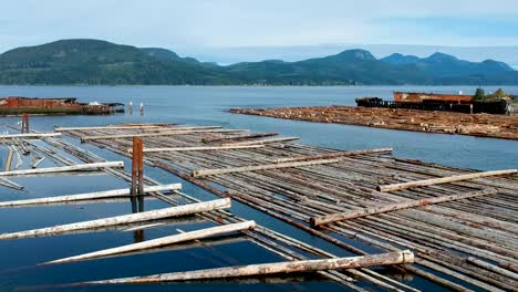 Log-booms-with-mountains-in-background