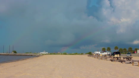 A-rainbow-arcs-over-a-quaint-beach