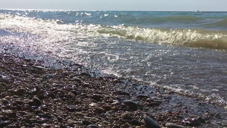 waves-crash-at-lake-on-pebble-beach-in-slow-motion