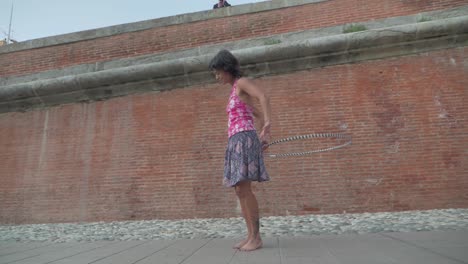 Slow-Motion-Close-up-and-Panning-of-Girl-Doing-Hula-Hoop