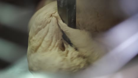Extreme-close-up-of-bread-dough-in-an-industrial-mixer