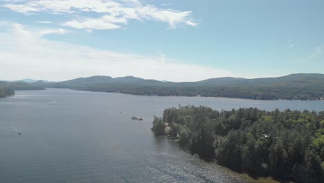 Aerial-drone-view-over-forest-lake-in-the-summer