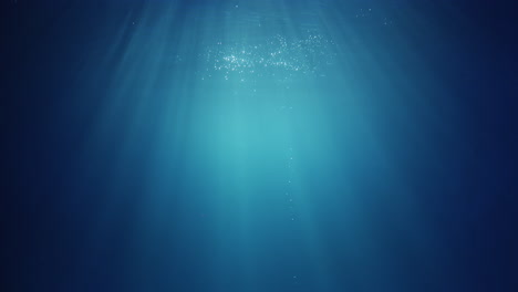 Underwater-sunlight-beams-shining-from-above-coming-through-the-deep-crystal-clear-blue-water-causing-a-beautiful-water-lighting-reflections-curtain