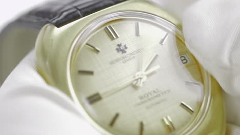 Close-up-of-a-watch-collector-with-white-gloves,-setting-the-dial-on-an-authentic-and-unique-Vacheron-Constantin-model