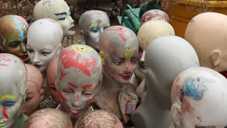 Mannequins-with-glasses-footage-with-some-snowfall-in-the-background-at-Randyland-in-Pittsburgh