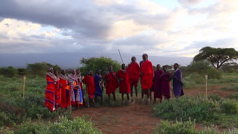 A-Maasai-tribe-engage-in-ritual-dances-at-sunset-on-tribal-lands-near-Amboseli-National-park-during-late-summer-under-cloudy-skies
