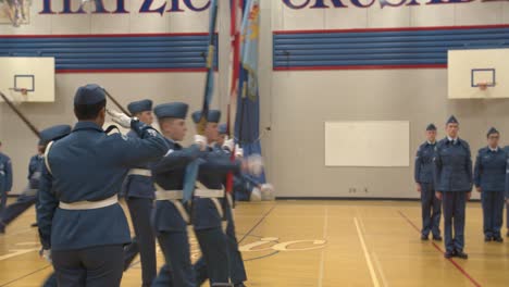 Canadian-Air-Cadet-flag-party-marches-past-a-squadron-commander-who-salutes-them