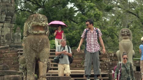 Close-Shot-of-Tourists-Exploring-the-Temples-of-Angkor-Wat