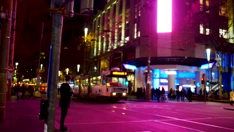 Melbourne-CBD-busy-intersection-nighttime-Melborune-busy-traffic-at-nighttime-with-tram,-cars-and-pedestrians