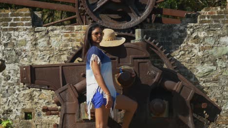 A-female-model-at-an-ancient-waterwheel-used-for-a-sugar-cane-plantation