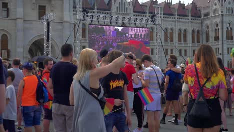 Colorful-people-getting-ready-to-march-in-the-Budapest-Pride,-gathering-infront-of-the-parliament