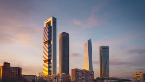 Timelapse-of-Cuatro-Torres-bussines-area-at-sunset