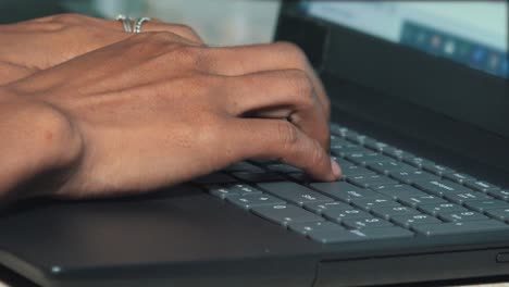 Medium-Close-Shot-of-Female-Hands-Typing-on-a-Laptop-Computer