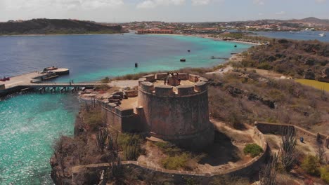 A-historic-castle-lies-on-the-rocky-outcrop-in-the-city-of-Willemstad-Curacao,-Fort-Beekenburg