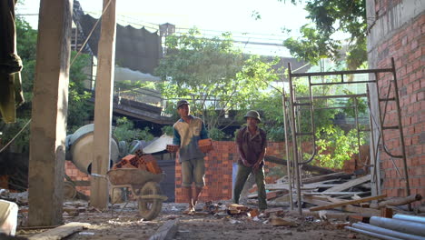Builders-throw-bricks-on-Construction-Site-in-Slow-Motion