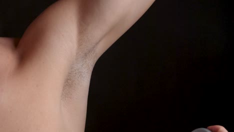 Male-Spraying-Fragrant-Deodorant-in-Armpit,-Using-Good-Hygiene,-Closeup