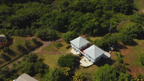 Amazing-aerial-of-a-guest-house-in-the-rural-fishing-village-of-Toco,-Trinidad