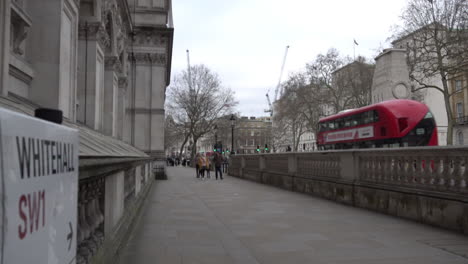 A-family-walks-along-an-almost-deserted-Whitehall-the-day-after-Prime-Minister-Boris-Johnson-warns-the-UK-population-to-avoid-all-non-essential-social-contact-due-to-the-Coronavirus-outbreak