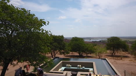 Unique-infinity-pool-at-the-Pangolin-Chobe-Hotel-in-Botswana,-pan-left