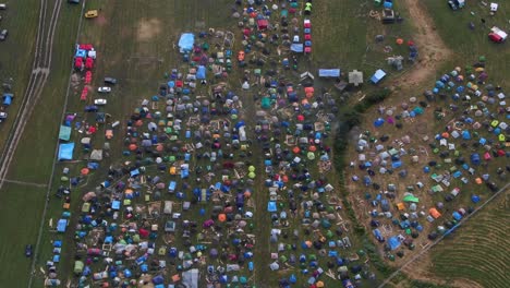Birds-Eye-Aerial-View-of-Colorful-Tents-Pitched-at-Music-Festival