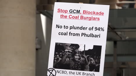 A-placard-says-“No-to-plunder-of-94%-coal-from-Phulbari”-on-a-protest-marking-the-14th-anniversary-of-three-killed-during-demonstrations-in-Phulbari,-Bangladesh
