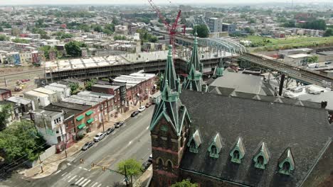Roman-Catholic-Cathedral-in-Philadelphia,-aerial-establishing-shot-of-poor-neighborhood-in-Northeast-Philly