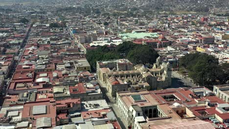 Aerial-View-of-The-Church-of-Santo-Domingo-de-Guzmán-in-Oaxaca,-Mexico-and-Surrounding-City-Blocks