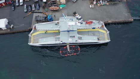 Aerial-top-down-shot-of-passenger-vessel-with-launched-liferaft-floating-alongside-during-emergency-drill
