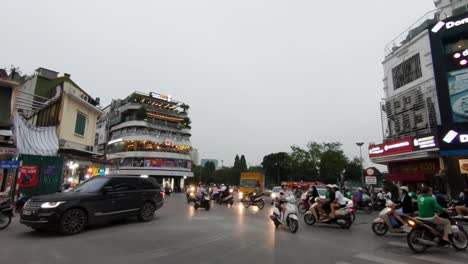 Busy-intersection-along-the-streets-of-Hanoi-in-the-evening-on-a-cloudy-day
