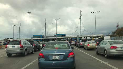 Many-cars-waiting-in-line-at-the-busiest-border-crossing-in-the-world,-Tijuana-to-San-Ysidro-San-Diego-Port-of-entry,-to-cross-over-from-Mexico-to-the-US